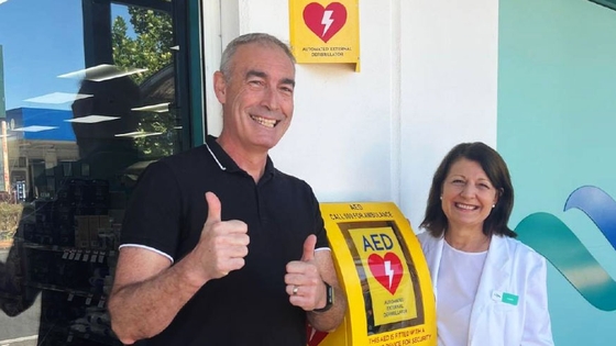 Greg Page, from Heart of the Nation, giving the thumbs up standing with a woman smiling