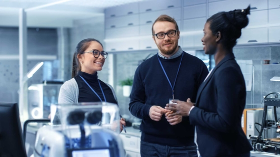 Group of three researchers or health professionals having a discussion