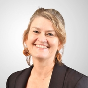 Le Smith in black blazer and white shirt, professional attire for work