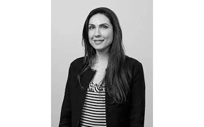 A monochrome image of Ms Isabelle Demir.