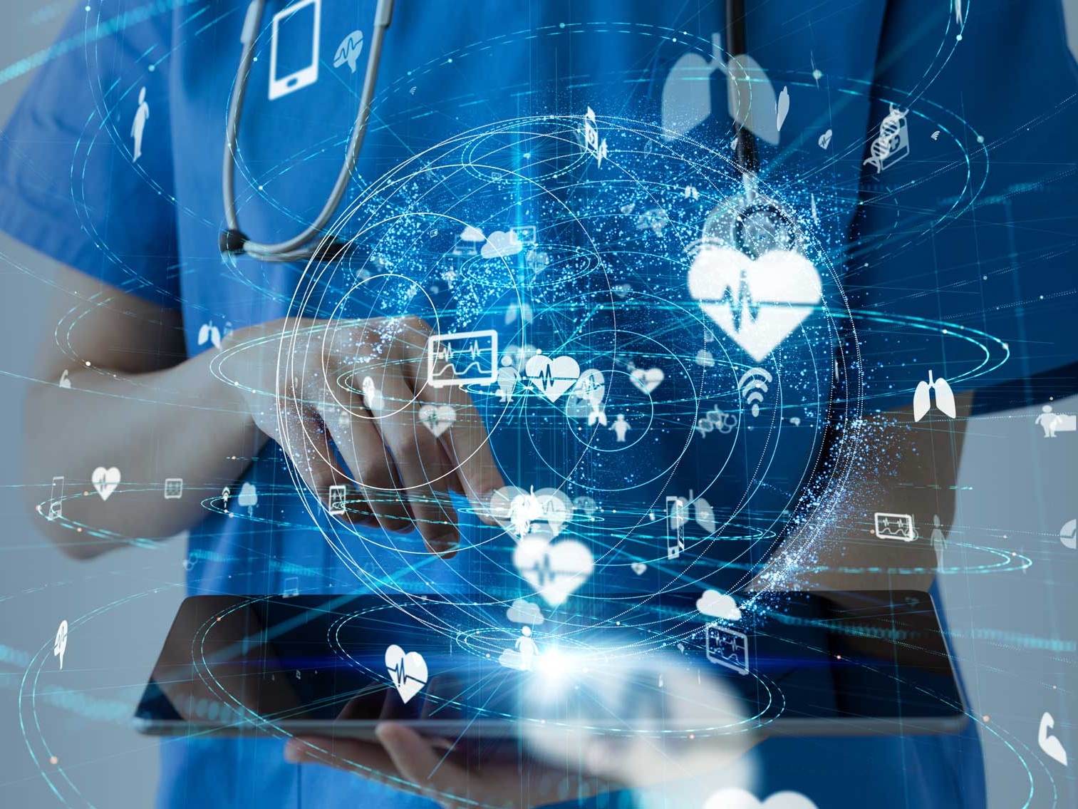 Medical professional holding a tablet, with imaginary heart research icons swirling around her hand